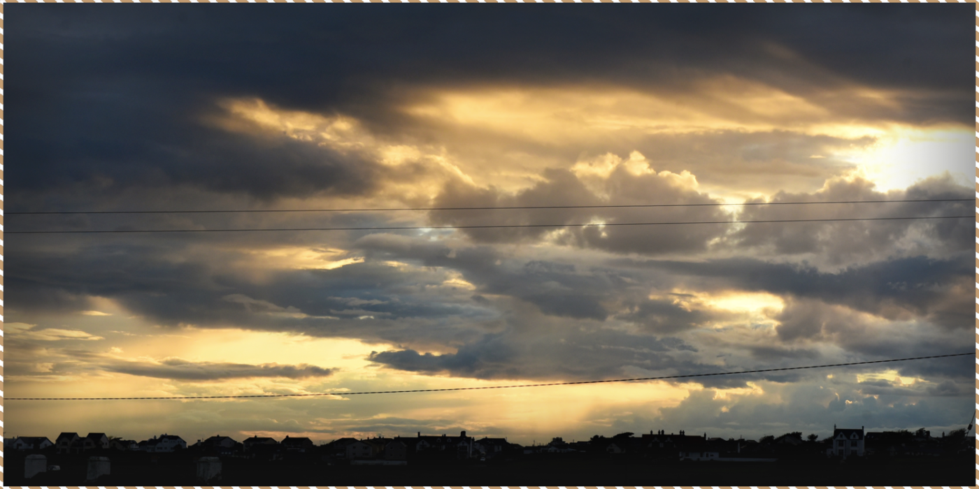 This picture heads a blog, showcasing a dramatic sky over our luxury cottage in Anglesey